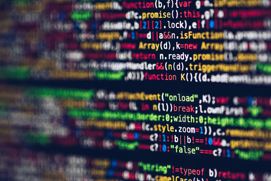 A close-up image of a computer screen displaying a multicoloured code editor with rows of programming code, including keywords, variables, and functions, in various hues such as red, green, blue, yell